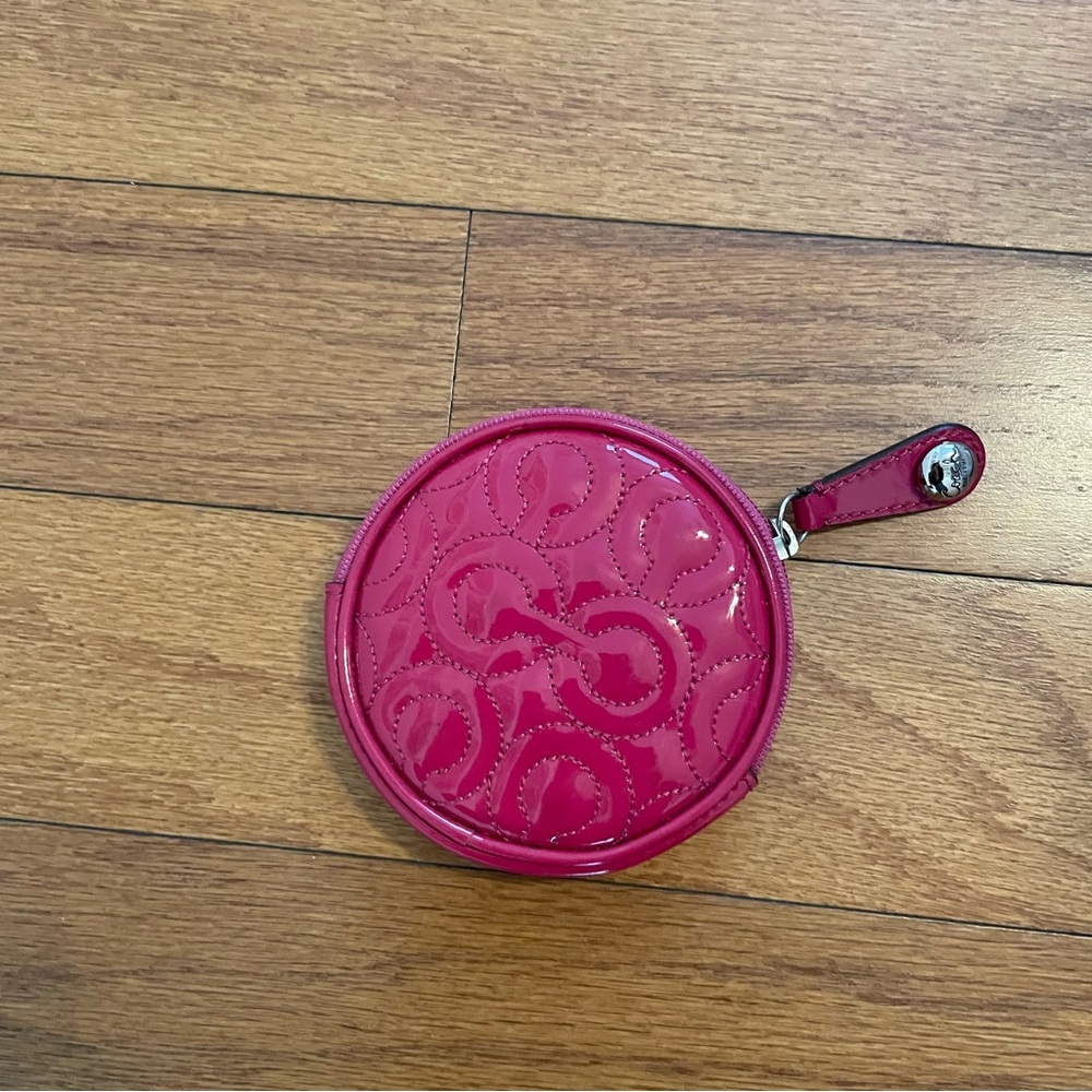 Cute pink patent leather COACH coin purse. Barely used.